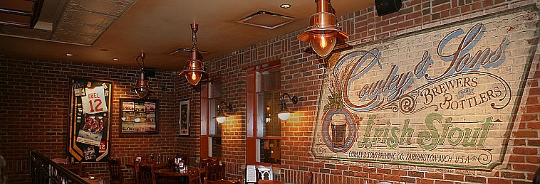 Oak paneling and painted signage inside Cowley's pub
